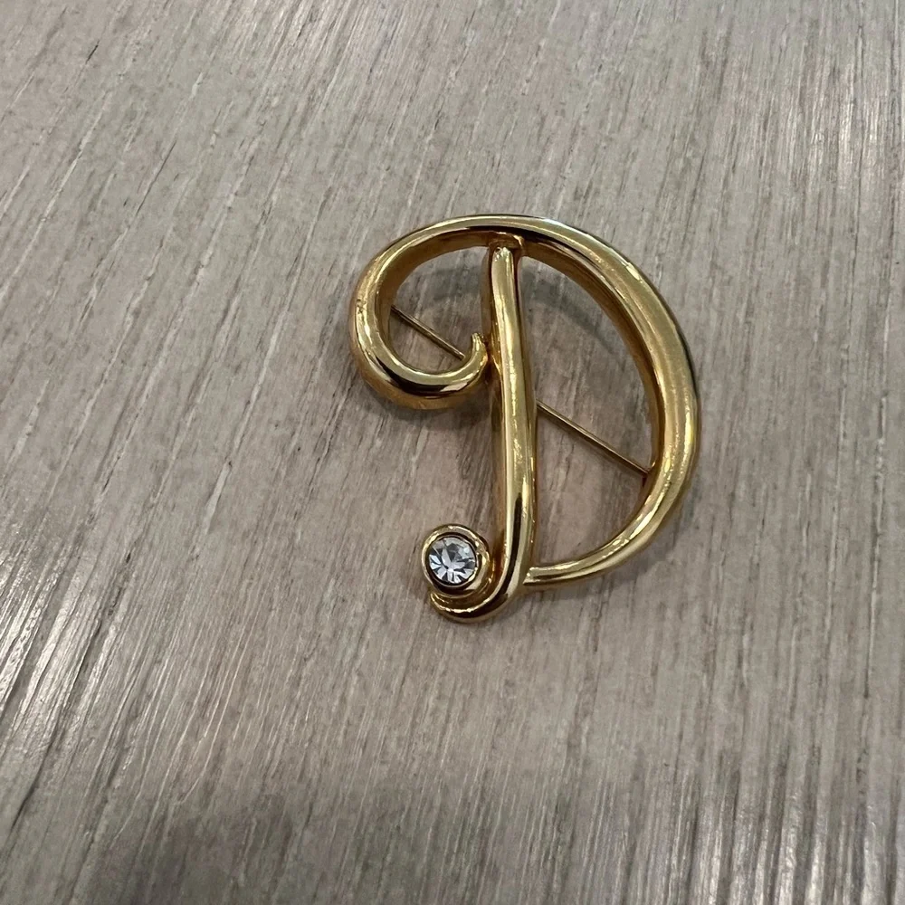 Vintage Monet D letter rhinestone brooch